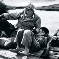 Robert Capa.novelist Ernest Hemingway and his son Gregory